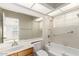 Bathroom featuring a soaking tub with grab bars, and a large mirror reflecting the bedroom at 10017 E Mountain View Road -- # 1045, Scottsdale, AZ 85258