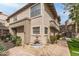 Charming stucco townhome featuring a well-maintained courtyard and decorative fountain at 10017 E Mountain View Road -- # 1045, Scottsdale, AZ 85258