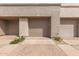 Attached garages offering convenient parking for residents in a neutral color scheme at 10017 E Mountain View Road -- # 1045, Scottsdale, AZ 85258