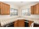 Functional kitchen featuring tile countertops and plenty of cabinet space at 10017 E Mountain View Road -- # 1045, Scottsdale, AZ 85258