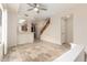 Open-concept living space featuring tile floors and a staircase at 10017 E Mountain View Road -- # 1045, Scottsdale, AZ 85258