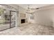 Comfortable living room with tile flooring, fireplace and access to the outdoor patio at 10017 E Mountain View Road -- # 1045, Scottsdale, AZ 85258