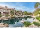 Beautiful community pond with tranquil water views, lush landscaping, and mature trees at 10017 E Mountain View Road -- # 1045, Scottsdale, AZ 85258