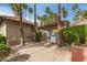 Private community pool entrance surrounded by palm trees and lush landscaping at 10017 E Mountain View Road -- # 1045, Scottsdale, AZ 85258