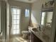 Bathroom features double vanity, a toilet and access to the yard and natural light at 10249 N 58Th Pl, Paradise Valley, AZ 85253
