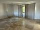 Bright and airy living room featuring travertine tile floor and modern curtains at 10249 N 58Th Pl, Paradise Valley, AZ 85253