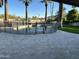 Backyard swimming pool surrounded by a stone patio and privacy fencing at 10249 N 58Th Pl, Paradise Valley, AZ 85253