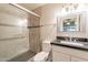 Modern bathroom with tiled shower and glass doors, toilet, and vanity at 1118 N Granite Reef Rd, Scottsdale, AZ 85257