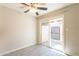 Bright bedroom featuring a ceiling fan and sliding glass door leading to a private patio at 1118 N Granite Reef Rd, Scottsdale, AZ 85257