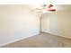 Bright bedroom featuring neutral walls, carpet, ceiling fan, and closet at 1118 N Granite Reef Rd, Scottsdale, AZ 85257