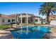 Stunning backyard featuring a pool, spiral staircase, and lush landscaping, perfect for entertaining at 11319 E Elmhurst Dr, Chandler, AZ 85249