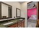 Bathroom with dual sinks and granite counters, offering style and functionality at 11319 E Elmhurst Dr, Chandler, AZ 85249