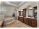 Bright bathroom with dual vanities, soaking tub, and walk-in shower at 11319 E Elmhurst Dr, Chandler, AZ 85249