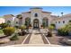 Stunning home featuring meticulously designed landscaping, a decorative gated entrance, and a beautiful front facade at 11319 E Elmhurst Dr, Chandler, AZ 85249