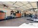 Spacious garage interior featuring workout equipment and ample storage cabinets at 11319 E Elmhurst Dr, Chandler, AZ 85249