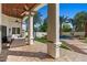 Covered patio showcasing outdoor seating with a spiral staircase leading to the backyard at 11319 E Elmhurst Dr, Chandler, AZ 85249