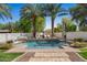 Beautiful backyard oasis featuring a refreshing pool, mature palms, and ample lounging space at 11319 E Elmhurst Dr, Chandler, AZ 85249