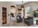Relaxing sitting area with neutral paint colors, tiled floors, and access to the backyard at 11319 E Elmhurst Dr, Chandler, AZ 85249