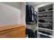 Walk-in closet with custom shelves, hanging rods and ample storage space at 11319 E Elmhurst Dr, Chandler, AZ 85249