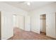 This bedroom features carpet, a ceiling fan, and sliding door closet at 11564 W Harrison St, Avondale, AZ 85323