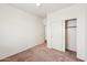 This bedroom has neutral carpet and sliding door closet at 11564 W Harrison St, Avondale, AZ 85323