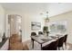 Formal dining room features stylish chairs, decorative lighting and ample space at 11564 W Harrison St, Avondale, AZ 85323
