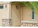 Front door close-up showing stone accents and the house number at 11564 W Harrison St, Avondale, AZ 85323