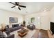 Bright living room featuring comfortable seating, a large window, and stylish decor at 11564 W Harrison St, Avondale, AZ 85323