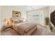 Serene main bedroom with a bay window, neutral tones, and a cozy atmosphere at 11564 W Harrison St, Avondale, AZ 85323