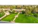 Lush estate featuring manicured lawns, mature landscaping, and serene water features at 12 E Oakwood Hills Dr, Chandler, AZ 85248