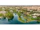 Scenic aerial view of the community, showcasing the lake, surrounding homes, and lush green landscape at 12 E Oakwood Hills Dr, Chandler, AZ 85248