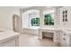 Bright bathroom featuring large windows, a soaking tub, a vanity, and plenty of storage at 12 E Oakwood Hills Dr, Chandler, AZ 85248