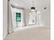Bright bedroom with large window, transom, neutral paint, and carpet flooring at 12 E Oakwood Hills Dr, Chandler, AZ 85248
