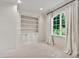 Bright bedroom with large window, transom, neutral paint, and built-in cabinets at 12 E Oakwood Hills Dr, Chandler, AZ 85248