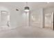 Bright bedroom featuring large windows, custom shelving, and access to an ensuite bathroom at 12 E Oakwood Hills Dr, Chandler, AZ 85248
