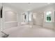 Open bonus room with custom wall designs and large windows providing plenty of light at 12 E Oakwood Hills Dr, Chandler, AZ 85248