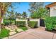 Manicured front yard with stone pathway, privacy wall, iron gate, and lush landscaping at 12 E Oakwood Hills Dr, Chandler, AZ 85248