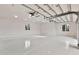 A clean garage with an immaculate floor, recessed lighting, storage, and dual windows at 12 E Oakwood Hills Dr, Chandler, AZ 85248