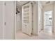 Hallway boasts built-in shelving and leads to additional living spaces at 12 E Oakwood Hills Dr, Chandler, AZ 85248