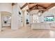 Spacious kitchen and breakfast area with large island, custom white cabinets, and stainless steel appliances at 12 E Oakwood Hills Dr, Chandler, AZ 85248