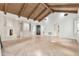 Spacious living room with vaulted wood ceilings, herringbone floors, and built-in shelving flanking the fireplace at 12 E Oakwood Hills Dr, Chandler, AZ 85248