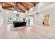 Large living room with hardwood floors, exposed beams, and comfortable seating at 12 E Oakwood Hills Dr, Chandler, AZ 85248