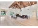 Spacious living room boasts vaulted ceilings with wood beams, neutral colors, and an open floor plan at 12 E Oakwood Hills Dr, Chandler, AZ 85248
