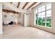 Spacious living room with hardwood floors, decorative chandelier, and a view of the landscaped gardens at 12 E Oakwood Hills Dr, Chandler, AZ 85248