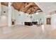 Open concept living room featuring hardwood floors, a fireplace, and comfortable seating arrangement at 12 E Oakwood Hills Dr, Chandler, AZ 85248