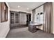Sophisticated home office with custom built-ins, large window, neutral carpet, and stylish finishes at 12 E Oakwood Hills Dr, Chandler, AZ 85248