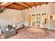 Cozy outdoor patio with brick flooring, comfortable seating, and French doors for a relaxing space at 12 E Oakwood Hills Dr, Chandler, AZ 85248