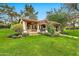 Inviting outdoor structure with a pergola, stone accents, and lush landscaping creating a serene escape at 12 E Oakwood Hills Dr, Chandler, AZ 85248