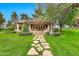 Charming outdoor structure with stone pathway, pergola, and lush landscaping perfect for entertaining at 12 E Oakwood Hills Dr, Chandler, AZ 85248