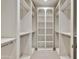 Spacious walk-in closet with custom shelving, closet rods, and carpet flooring at 12 E Oakwood Hills Dr, Chandler, AZ 85248